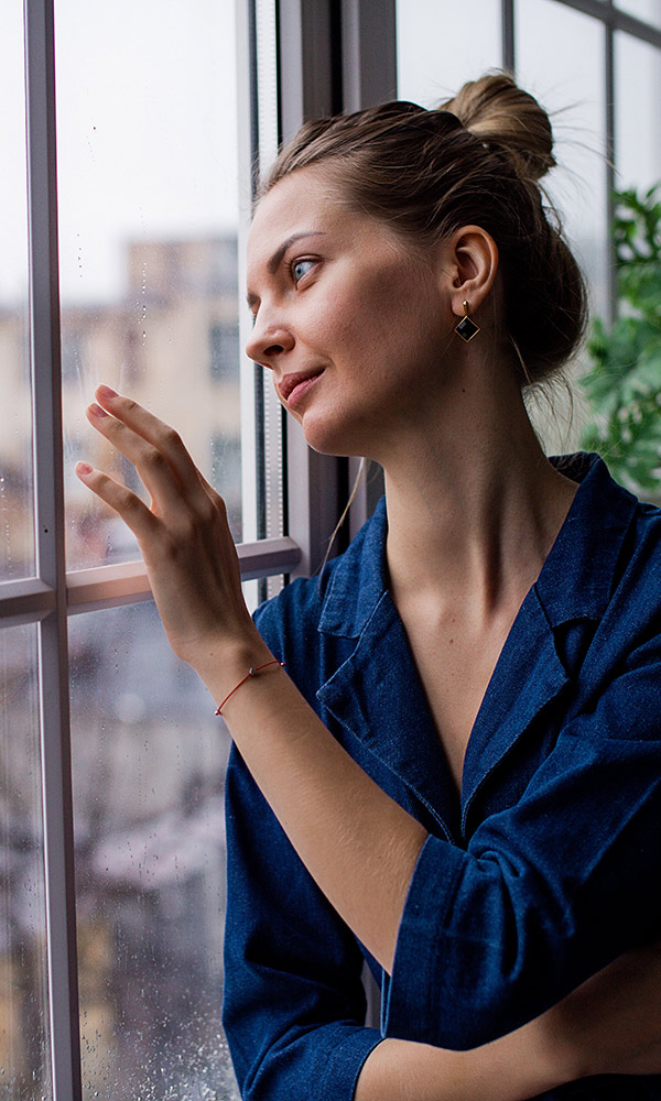 Health Psychology Center Of New York Depression & Mood Disorders Page Our Services & Treatments Woman looking out a window